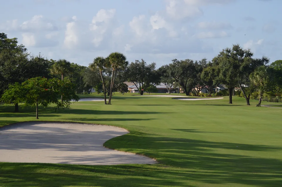 A view across the left bunker at Village Golf Club’s first hole